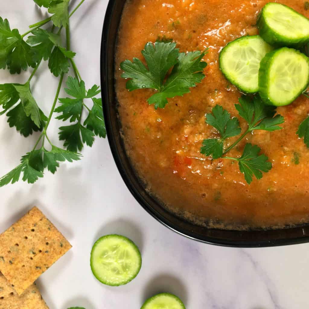 fresh tomato soup with crackers and cucumbers