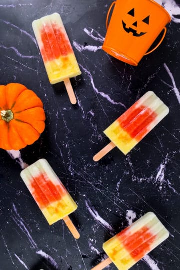 honeydew ice pops with mini pumpkin and candle