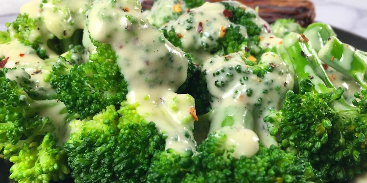 cheese sauce on broccoli