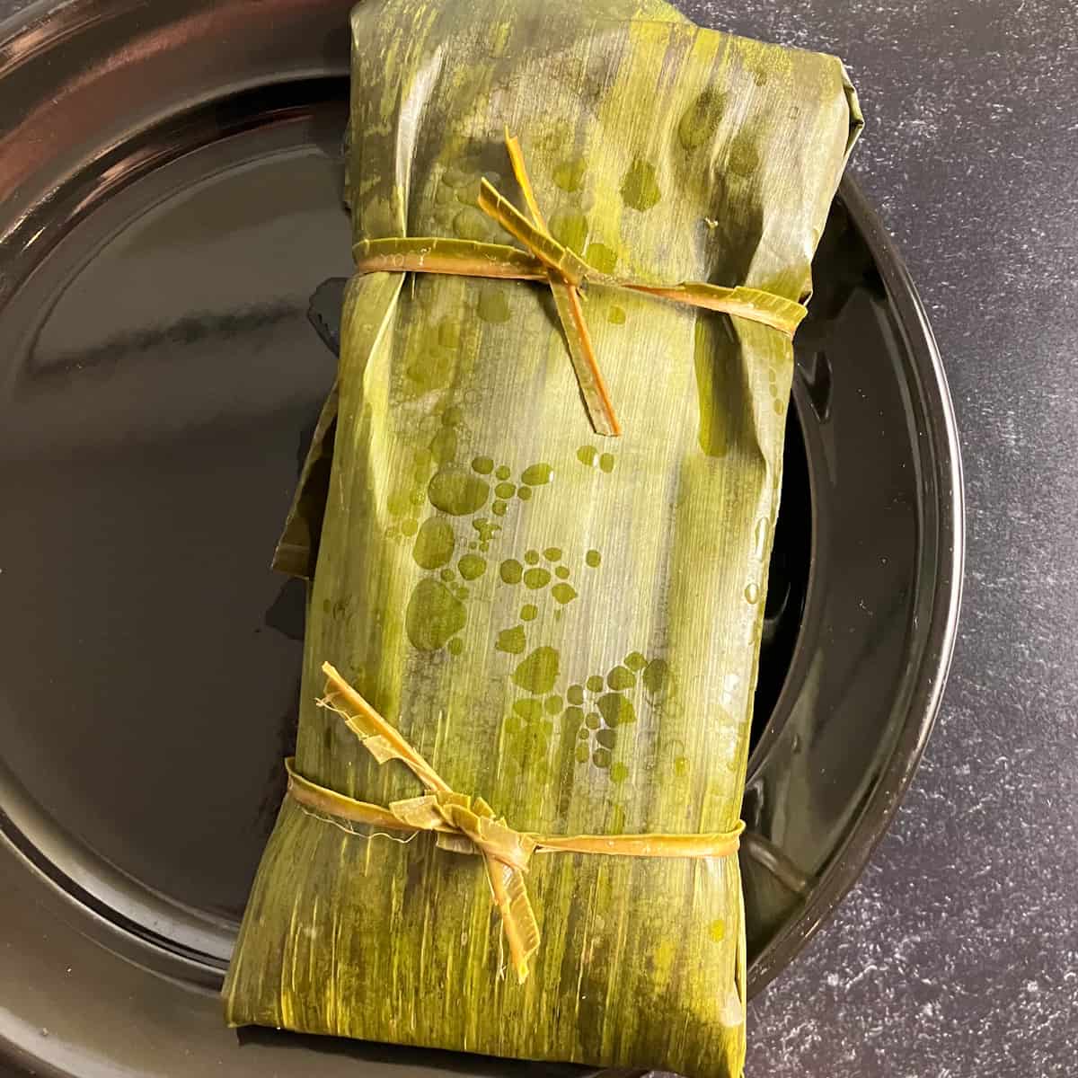 fish wrapped in banana leaves